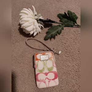 Coach Poppy Multicolor Patterned Wristlet With Top Zipper.